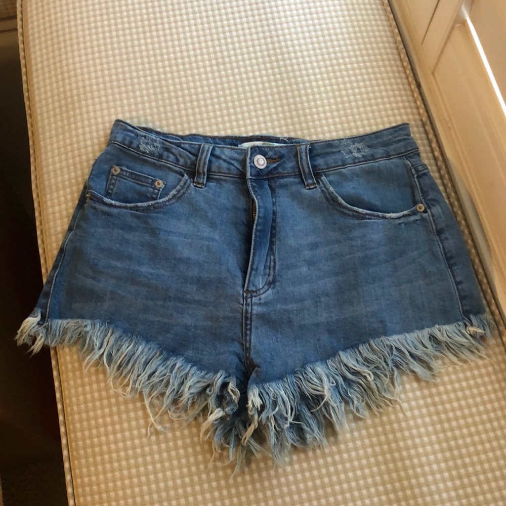 Medium washed distressed jean shorts